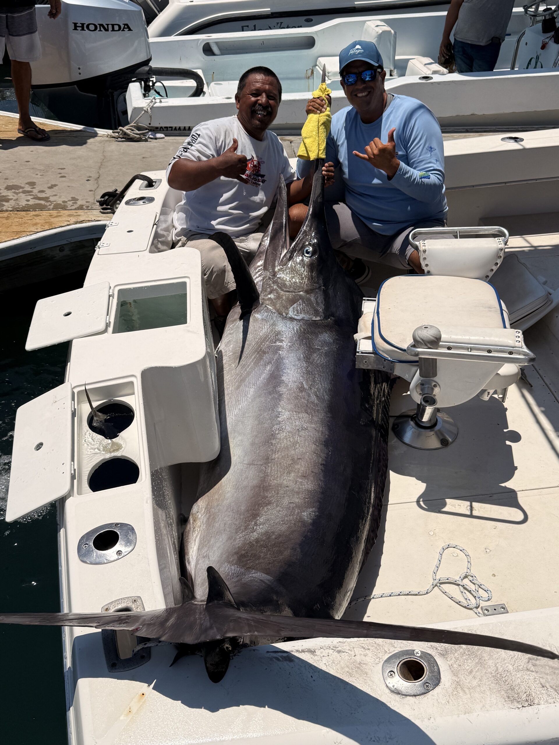 Daliken crew Capt. Ulices and mate Chuyito with the black marlin at the transom — Gordo Banks, Cabo