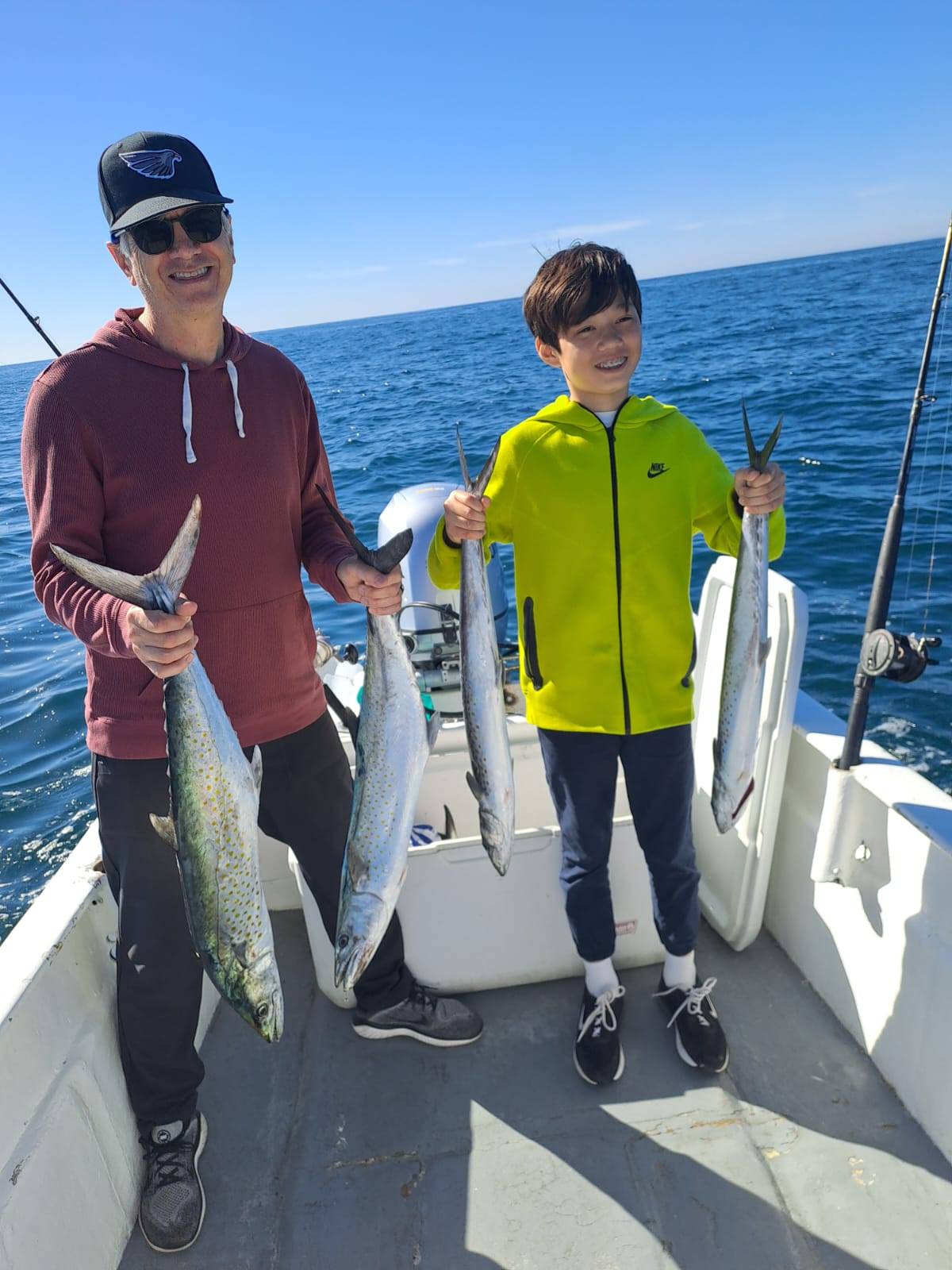 Angler holding a freshly caught sierra mackerel during a fishing trip with Daliken Sportfishing in San José del Cabo