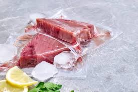 Vacuum-sealed fish fillets labeled and packed for airport travel from Cabo