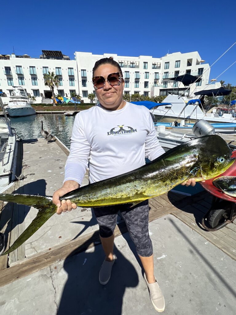 Captain Jaime preparing rods and tackle for a fishing charter in San José del Cabo
