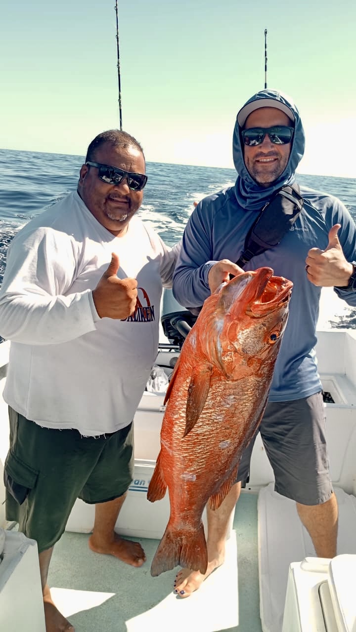 Angler with a quality snapper pargo caught over structure