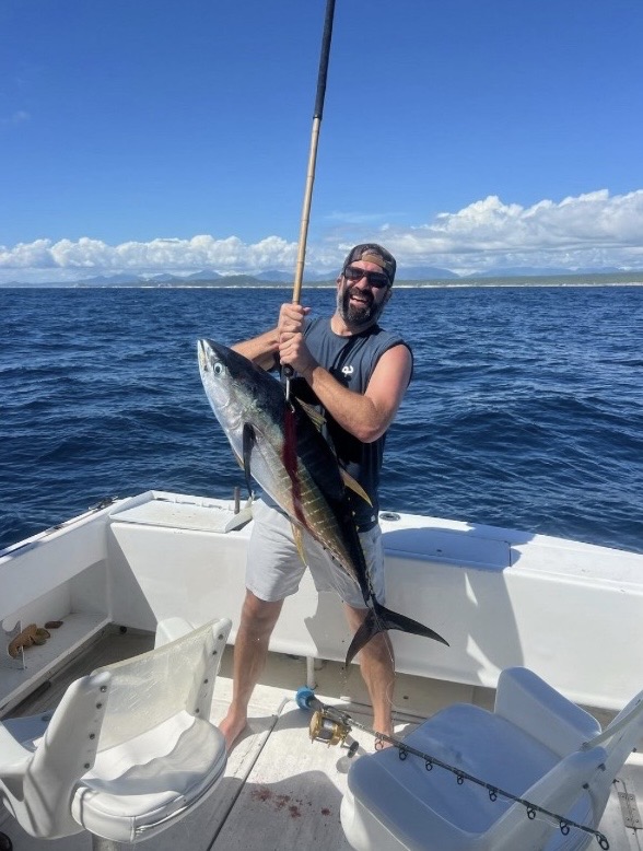 Angler holding 50 lb yellowfin tuna in San José del Cabo