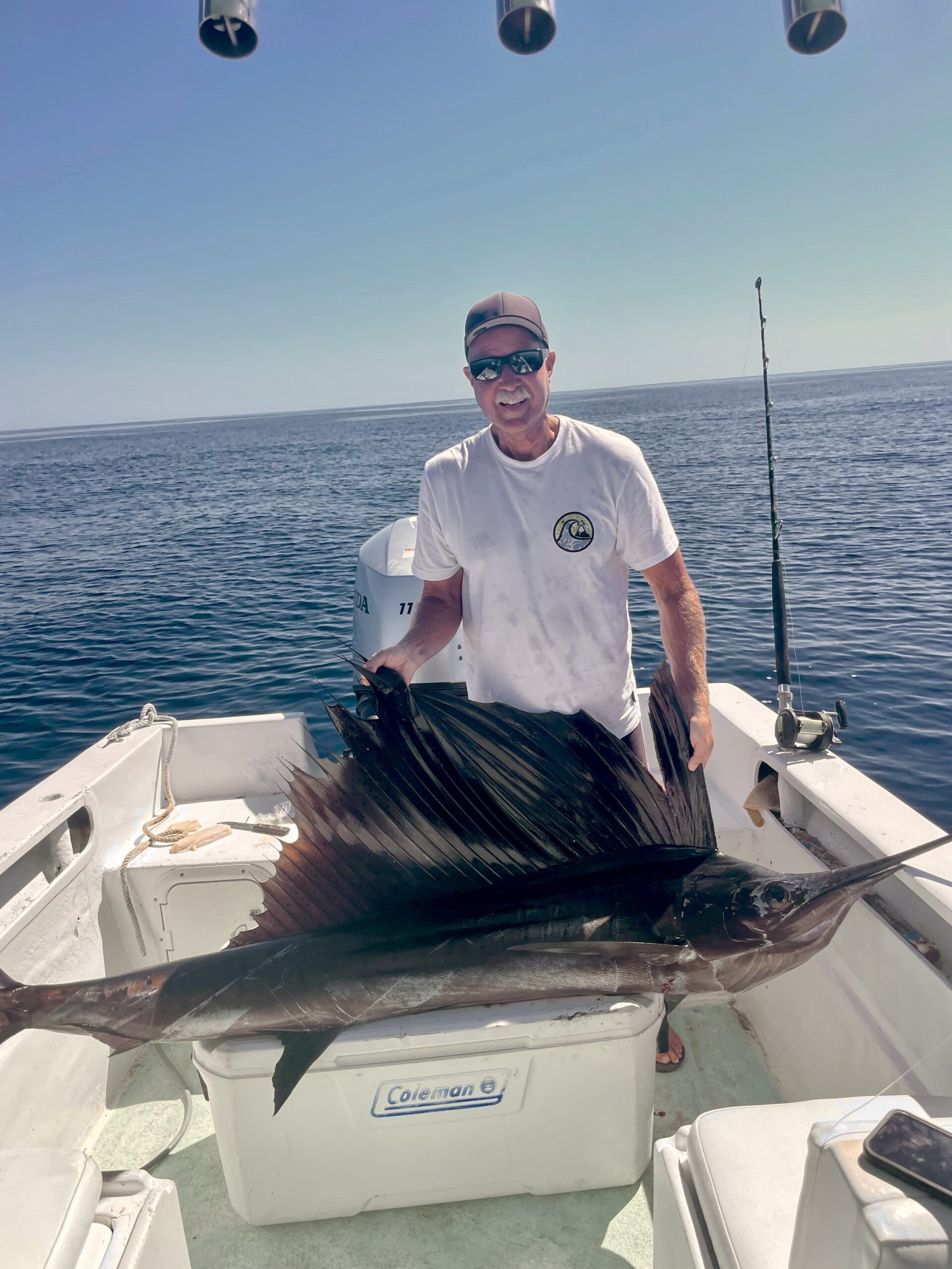 Anglers posing with a sailfish before release near San José del Cabo