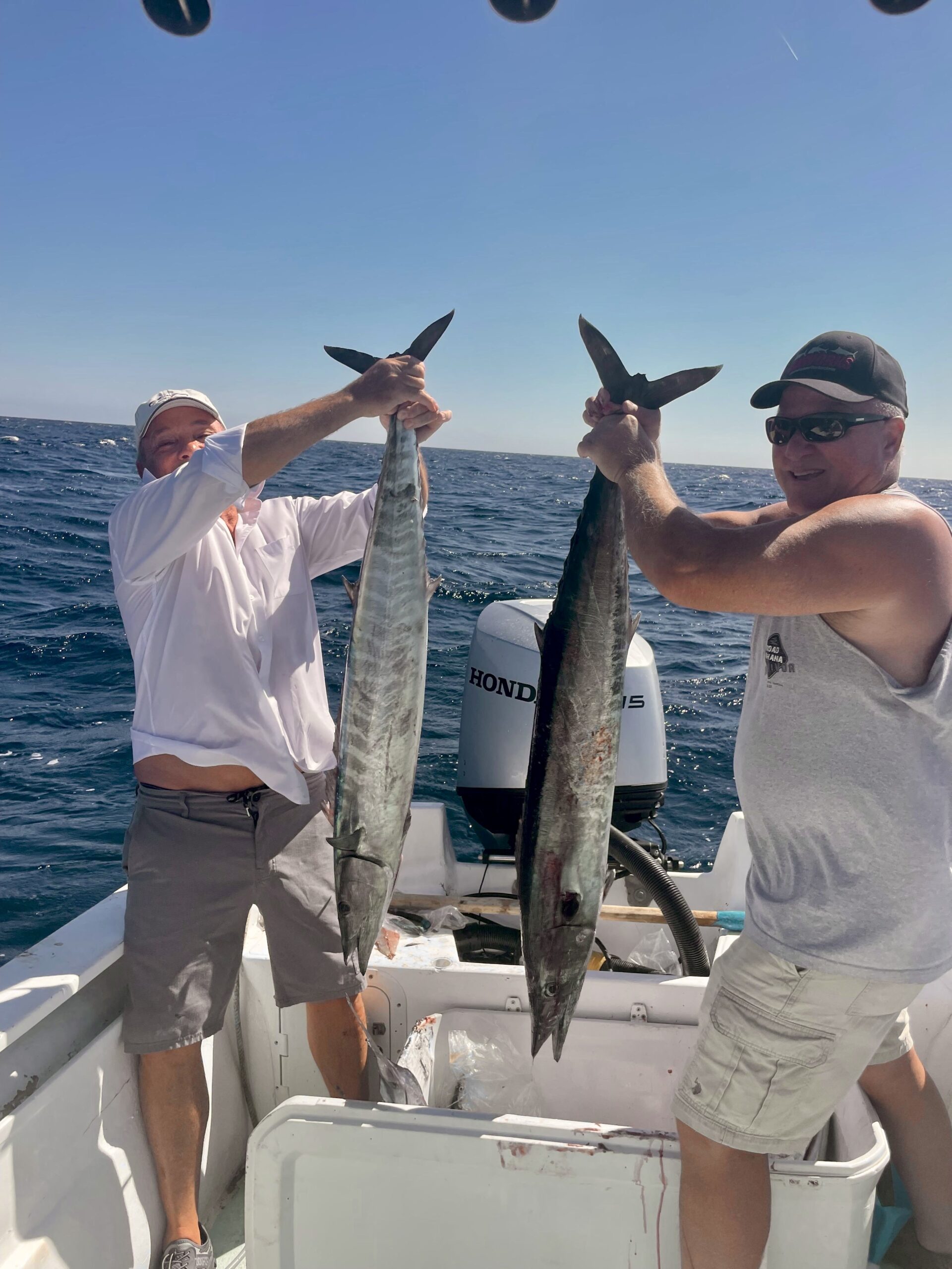 Happy anglers with a 25 lb class wahoo caught at Iman Bank, San José del Cabo