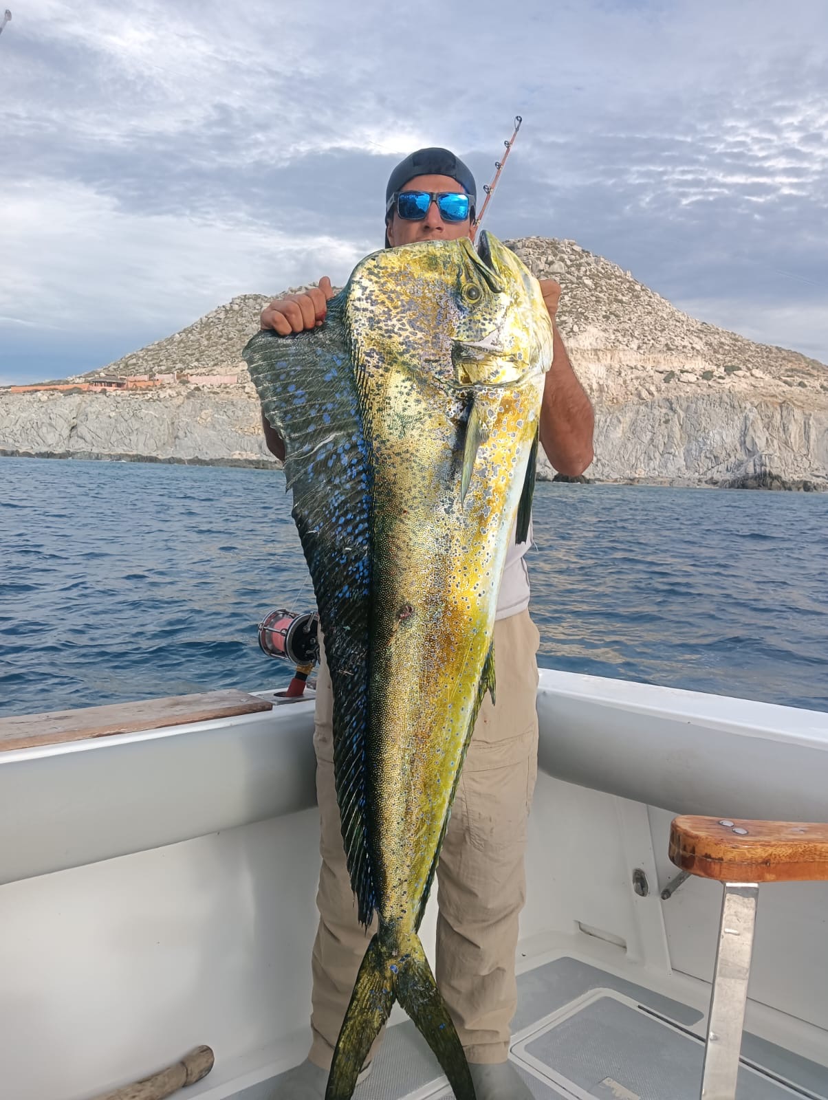 Two anglers smiling with mahi mahi dorado after a morning fishing trip near Palmilla in Los Cabos