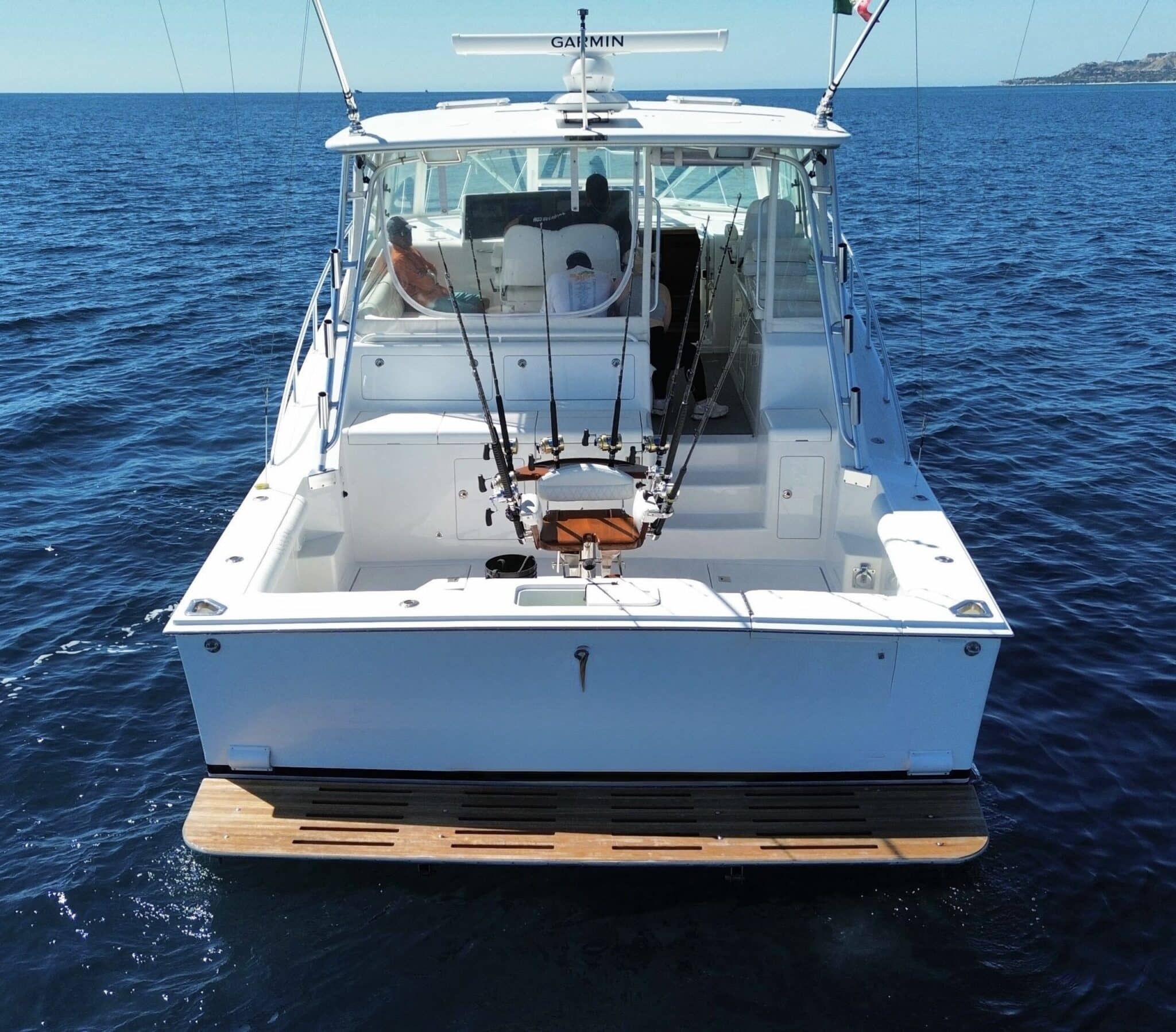 Cabo 48ft private yacht with shaded lounge area in Los Cabos