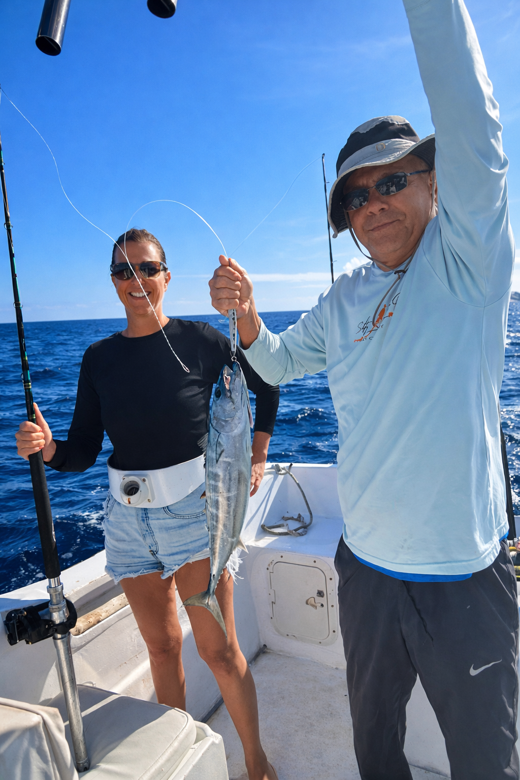 Client smiling with a bonito catch on a morning fishing trip in San Jose del Cabo