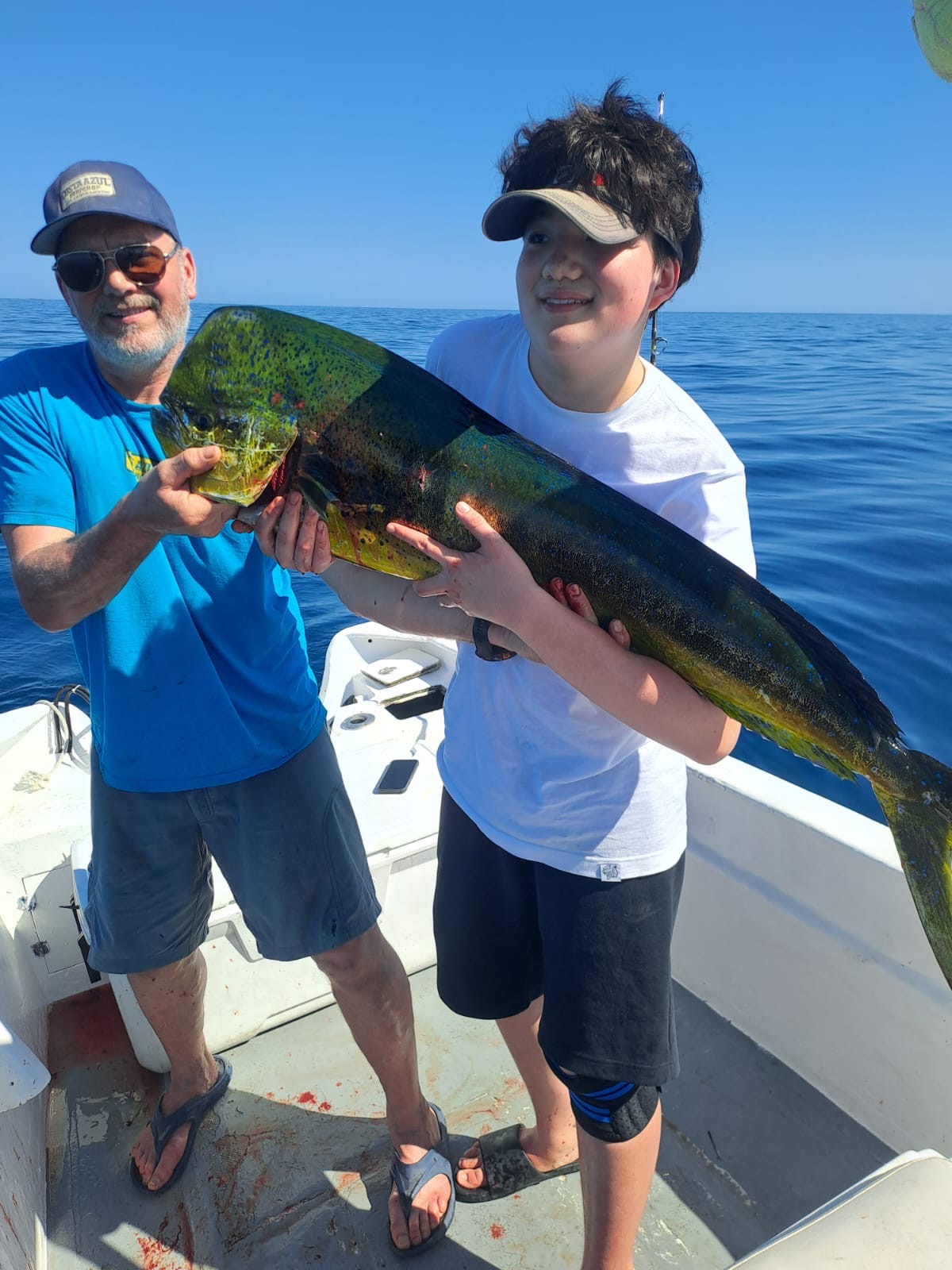 Happy fishing charter clients with catch in Baja California Sur