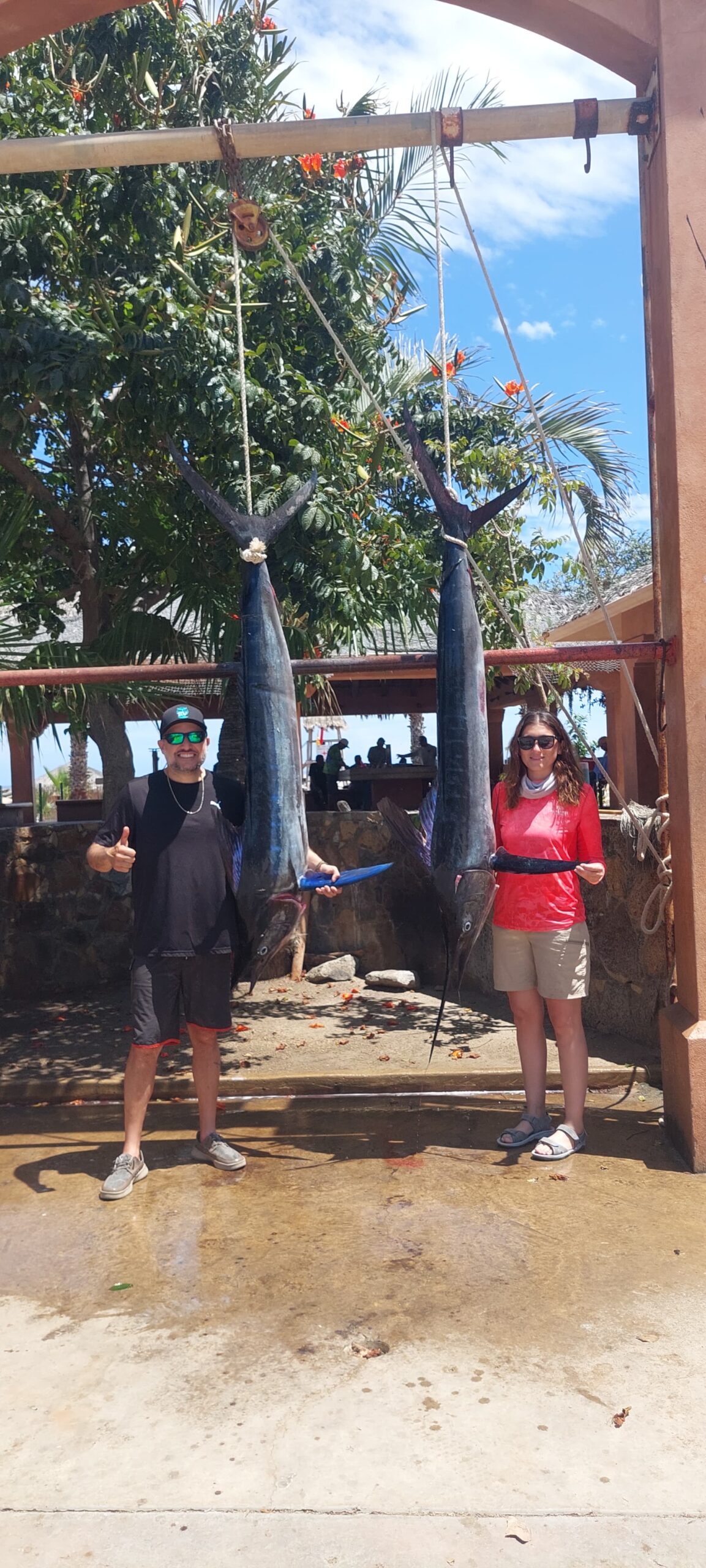 Private charter clients holding quality fish in San José del Cabo after a successful outing