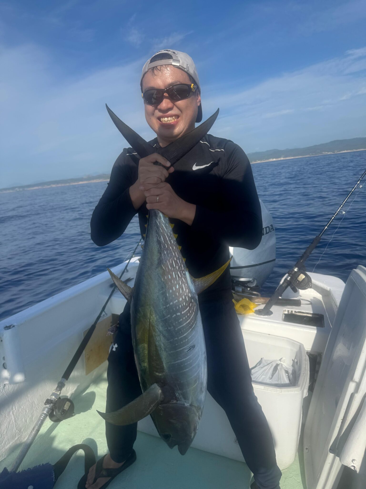 Angler holding a school size yellowfin tuna caught on live sardines near San Jose del Cabo